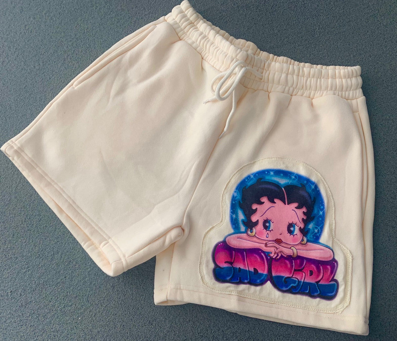 Sad Girl Betty' Custom Airbrushed Embroidered Cut & Sew Fleece Sweatshorts (Drawstring w/ pockets) TAN